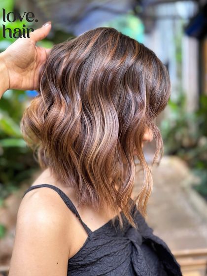 A close-up of the low-maintenance balayage on a bob, showing the soft, blended highlights that will grow out beautifully.