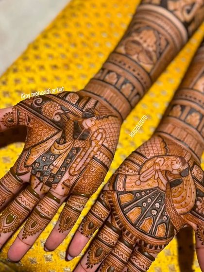 This design features a bride and groom on the palms, with one hand showing the bride in a doli. The use of negative space makes the figures pop.