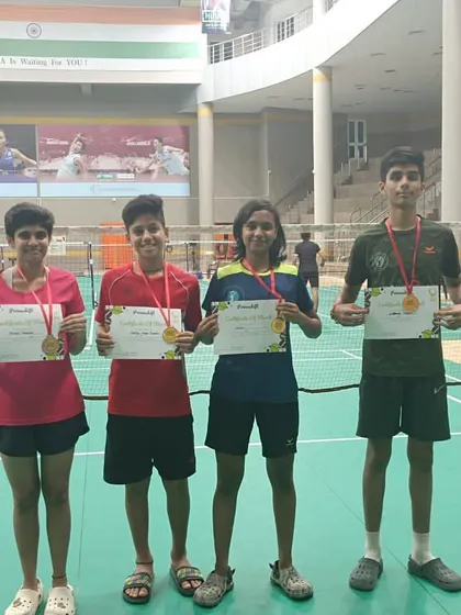 We are immensely proud of our players' achievements. Here, our students display the medals and certificates they earned at the Primeshift Badminton tournament, a testament to their hard work and the effectiveness of our competitive training programs.