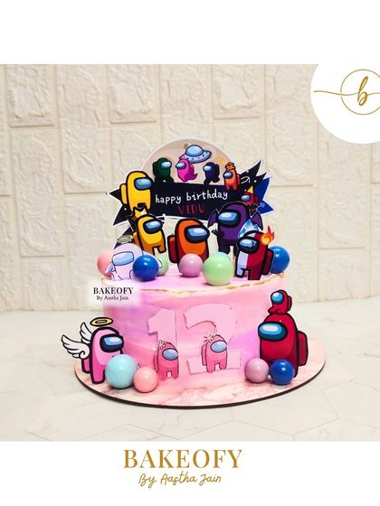 An "Among Us" themed birthday cake. This 1kg chocolate mousse cake is perfect for a gaming fan's party, complete with colorful crewmate toppers.