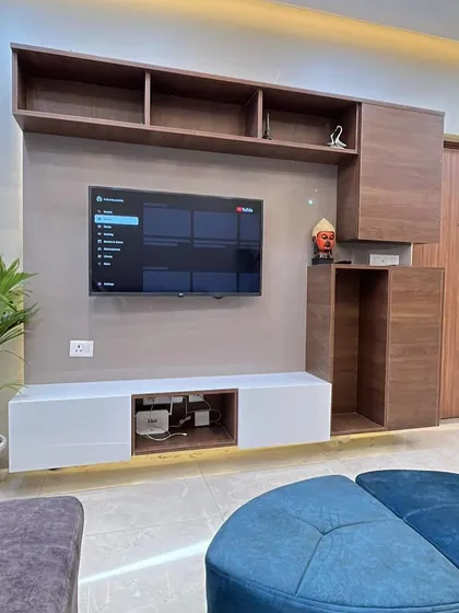 Another angle of the TV unit, showing the ample overhead storage and clean, modern lines.