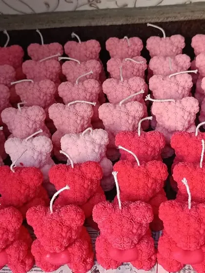 Another view of the large batch of teddy bear candles.