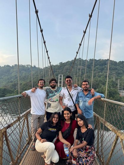 A small group enjoying the view from the suspension bridge in Honnavar.