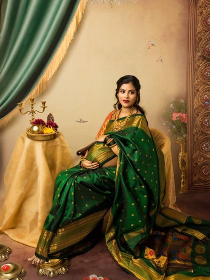 A regal portrait of a mother expecting twins, dressed in a magnificent green and gold traditional saree. This image is inspired by the classic paintings of Raja Ravi Varma, celebrating motherhood with royal grace.
