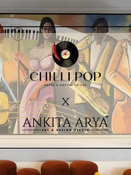A close-up of the collaboration logo over the hand-painted jazz mural at Chilli Pop, highlighting the bespoke nature of the project.