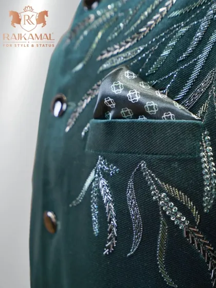 A detail shot of the pocket and embroidery on the green velvet Jodhpuri.
