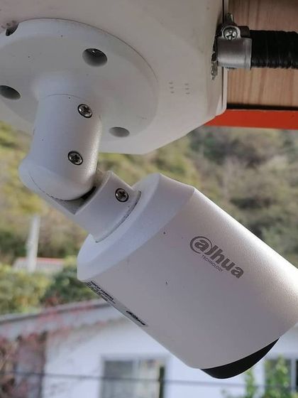 Another angle of the professionally mounted Dahua camera, showing its adjustable bracket which allows us to fine-tune the viewing angle during installation.