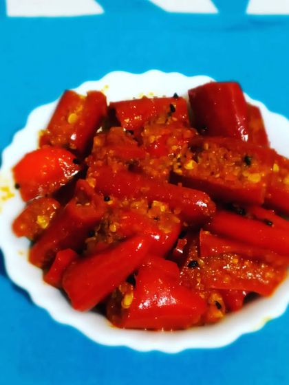 A small bowl of my homemade Red Chilli Pickle, ready to be served. The vibrant red colour is completely natural.