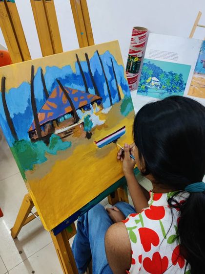 See how a student builds up a vibrant tropical beach scene, learning to paint palm trees, a hut, and the sandy shore.