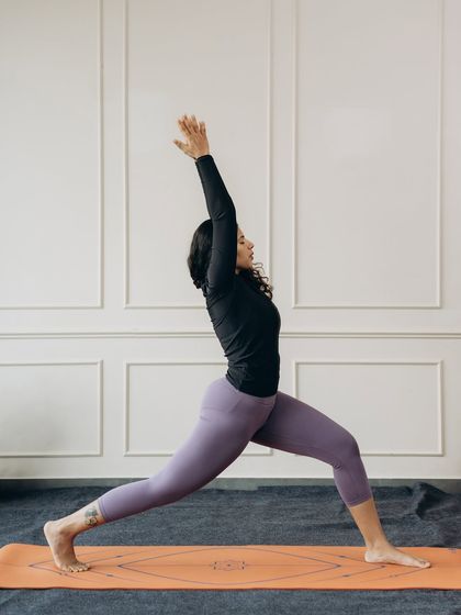The powerful and uplifting High Lunge pose, a foundational stance that builds leg strength and stability.