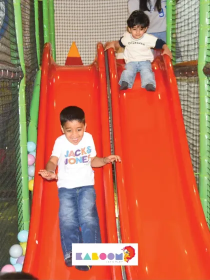 Weee! Racing down the slides is a classic part of the fun at Kaboom.