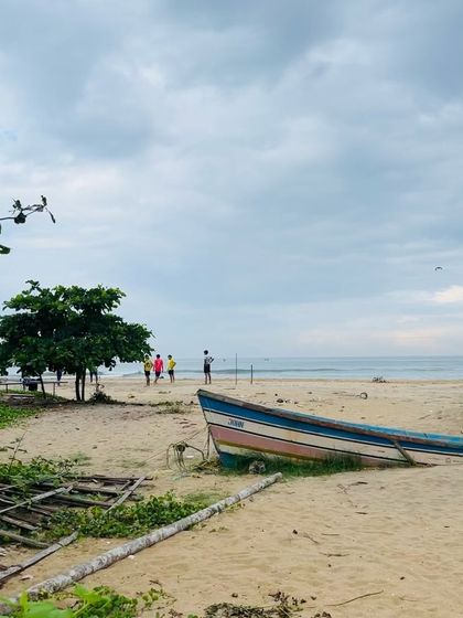 The beautiful, calm beach in my hometown that served as my inspiration. The soft sand, gentle waves, and scattered boats create a peaceful atmosphere that I love to paint.