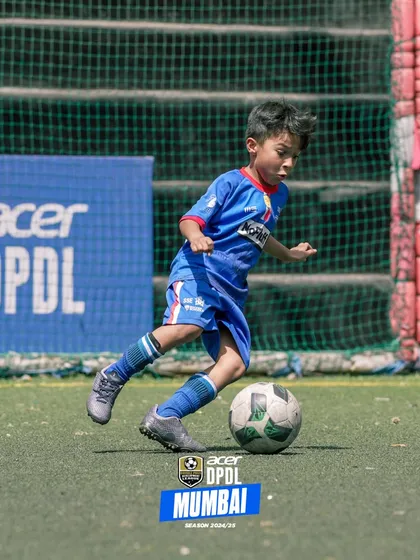 One of our youngest players showing great ball control and composure.