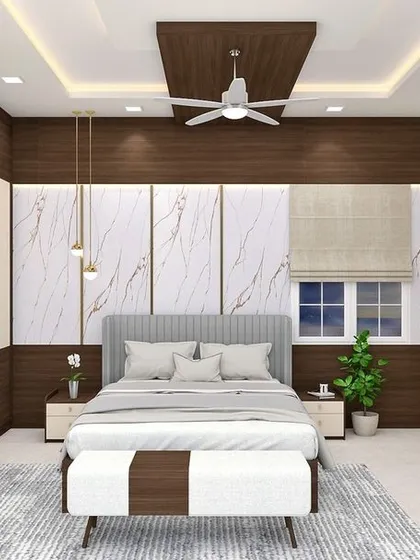 We transform bedrooms into personal sanctuaries. This design combines the elegance of marble-textured wall panels with the warmth of dark wood, complemented by custom wardrobes, a dedicated dressing unit, and soft ambient lighting for a truly luxurious feel.