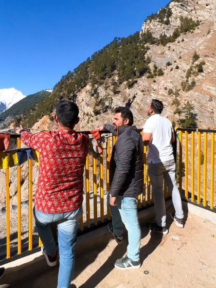 Friends enjoying the mountain view, a candid moment of travel and companionship.