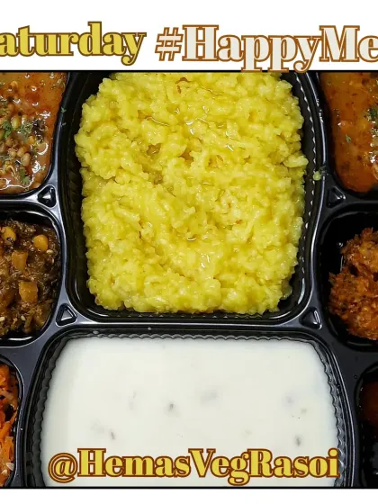 A comforting plate of Kadi Khichdi served with matki gravy, muli sabji, a tangy kairi carrot salad, and crispy corn pakodas.