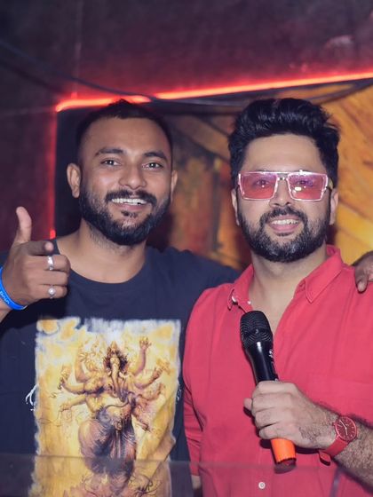 Posing with a happy guest after his performance. Connecting with the people who come to my shows is a huge part of the experience for me.