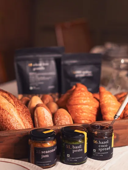 A selection of our essential pantry jars, including seasonal jam, basil pesto, and hazel coco spread. These are perfect for stocking your own kitchen or creating a custom gift hamper.