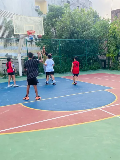 A player takes a shot over a defender.