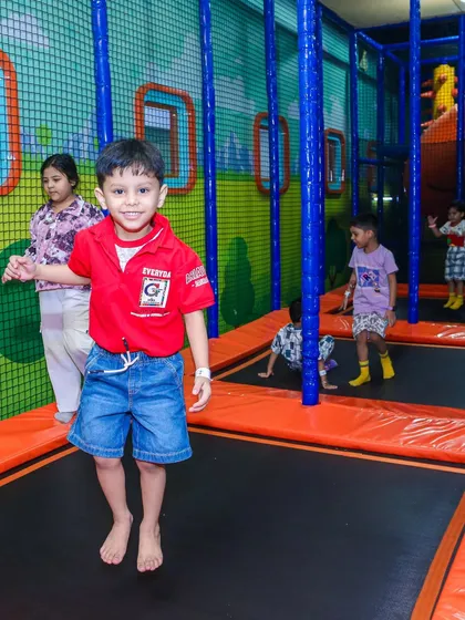 A boy mid-jump on the trampoline, taking full advantage of our Summer Fun Pass.