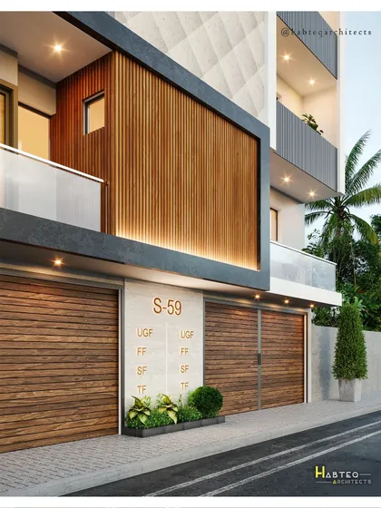 A close-up detail of the ground and first floor of the S-59 residential project. This view shows the texture of the WPC louvers and the clean lines of the entryway and parking shutters.