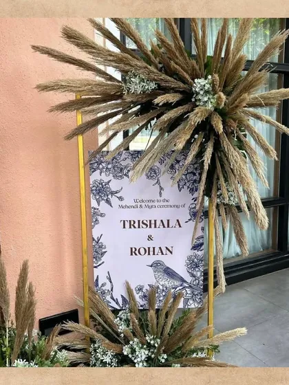 This welcome board for a Mehendi ceremony has a lovely boho feel. The sign is framed with an explosion of pampas grass, adding a touch of natural, rustic elegance to the entrance.