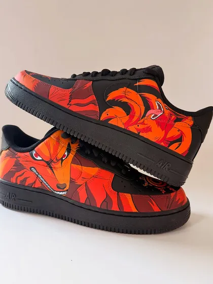 For all the anime lovers, this one was a beast to create. I transformed these all-black Nike Air Force 1s with a depiction of Kurama in his full Nine-Tails form. The fiery oranges and reds pop against the black, capturing the raw energy of the character. This is a perfect example of how I bring powerful anime art to life on footwear.