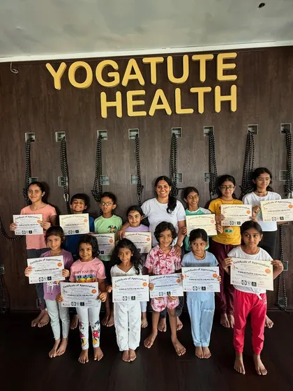 A group photo with the graduates of our April kids' summer camp. It's wonderful to see their happy faces after a camp filled with yoga, learning, and fun.