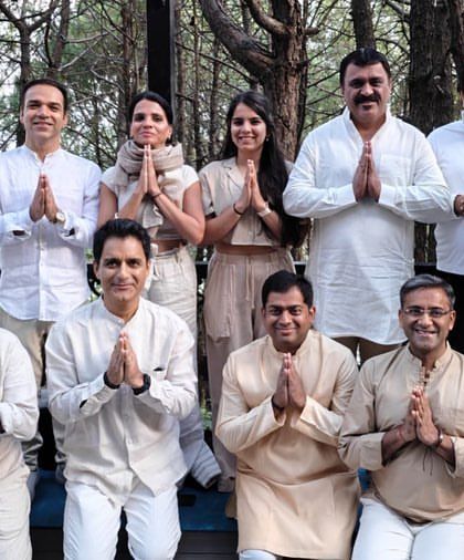 The men of our yoga family, sharing a moment of gratitude and connection after a powerful session. Yoga is for everyone, and we welcome all to our community.