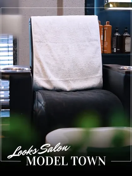 A clean and ready styling station, complete with fresh towels, showcasing our commitment to hygiene and client comfort.