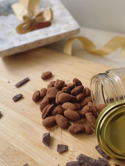 Our cocoa-dusted almonds are a highlight of our Mini Rakhi Hampers, offering a sophisticated and delicious treat.