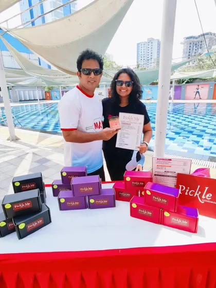 Here I am at a Pickle Ball tournament where my brand was a prize partner. It's always a joy to connect with people and share my passion for good food at fun events.