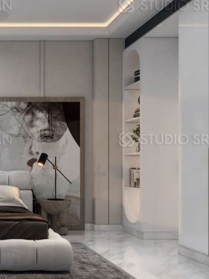 This view highlights the built-in storage, which includes an open, curved shelving unit for displaying personal items.