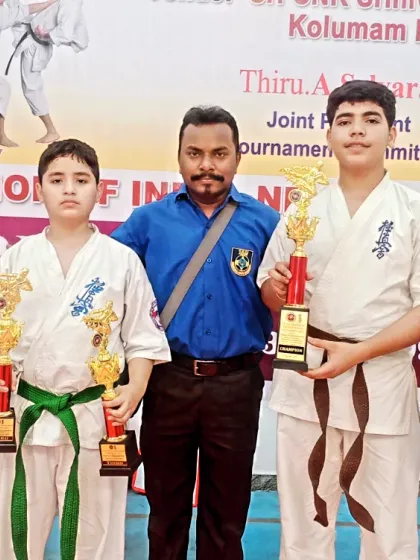 Posing with my winning team. Their success at the national level is a testament to the effectiveness of our training.