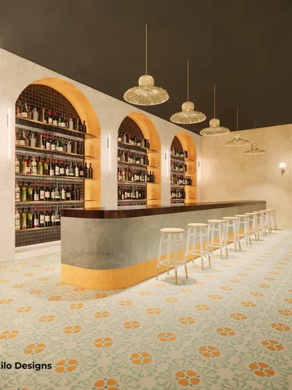 This cafe design was inspired by Scandinavian principles, using a warm tan color palette and natural textures. The standalone bar, with its arched shelving and patterned tile base, serves as the central, eye-catching feature of the space.
