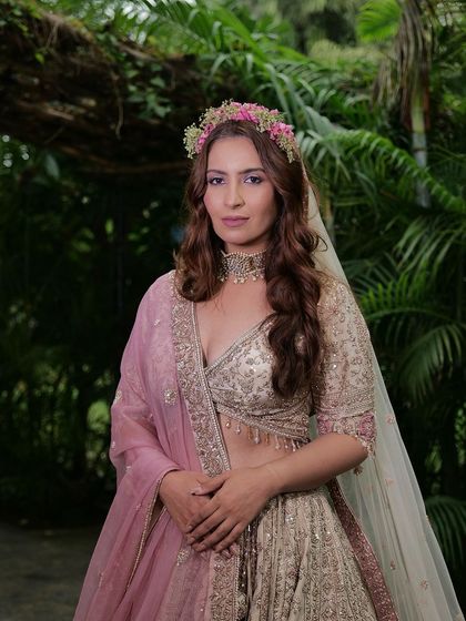 Another enchanting photo from the fairytale shoot. The floral crown and veil perfectly complement our delicate pastel lehenga.