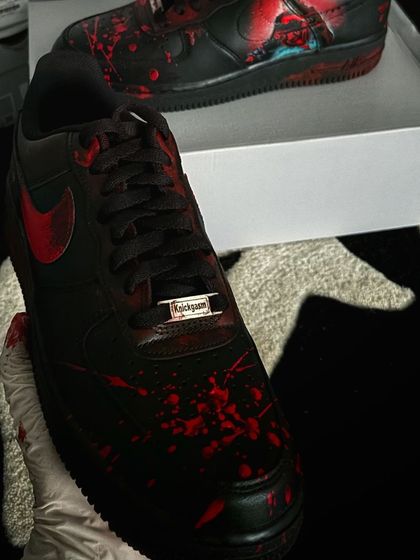 A front view of the "Stree 2" custom sneakers, highlighting the custom "Knickgasm" lace lock.