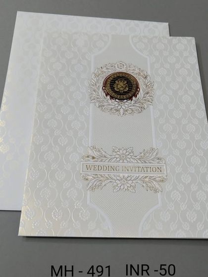 A simple and classic white invitation with a gold and black emblem. The embossed background adds a subtle texture to this affordable and elegant card.