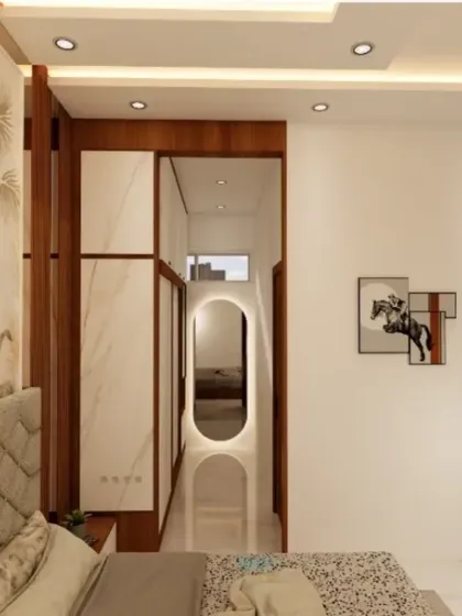 A view from the bed, showing the passage to a walk-in closet or dressing area, highlighting the well-planned layout of the master suite.