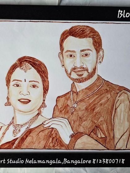 A classic couple's portrait, hand-painted with blood. The final framed piece shows the couple in a traditional pose, making for a timeless and elegant piece of custom art.