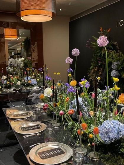 The full view of the elegant long table, where modern design meets natural beauty. We work with top decorators to ensure the ambiance is as exquisite as the food.