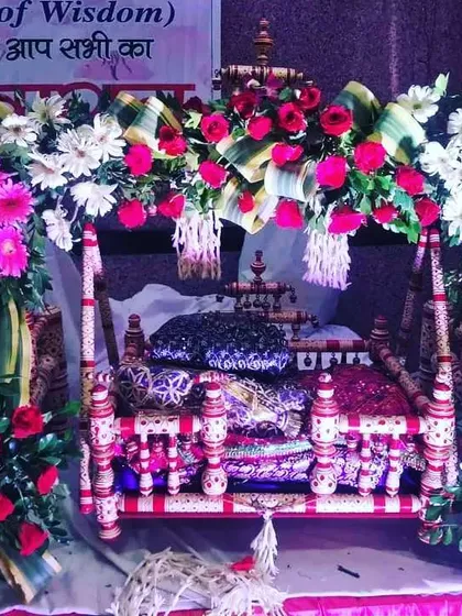 Here is another jhula decoration for a Janmashtami celebration. I used a mix of colorful flowers like pink roses and white and pink gerbera daisies to create a vibrant and joyful look for Lord Krishna's cradle.