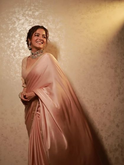 The movement of this satin saree on Wamiqa Gabbi is captured beautifully here. My draping technique ensures the fabric flows like liquid gold.