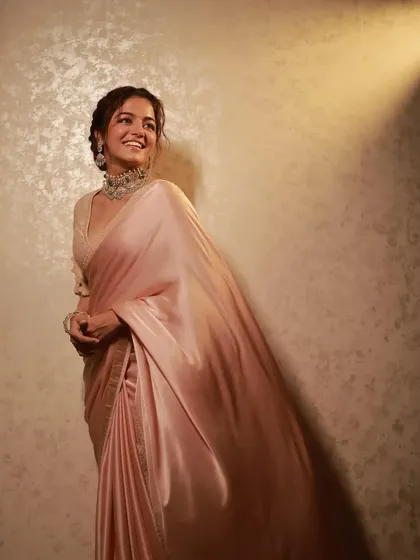 The full look of Wamiqa Gabbi's satin saree. The drape is styled to create a sense of movement and grace.