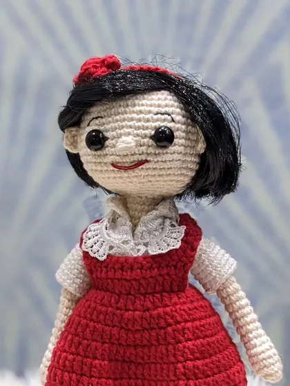 Another view of the custom 'jija' doll, highlighting the hairstyle with a little red bow.