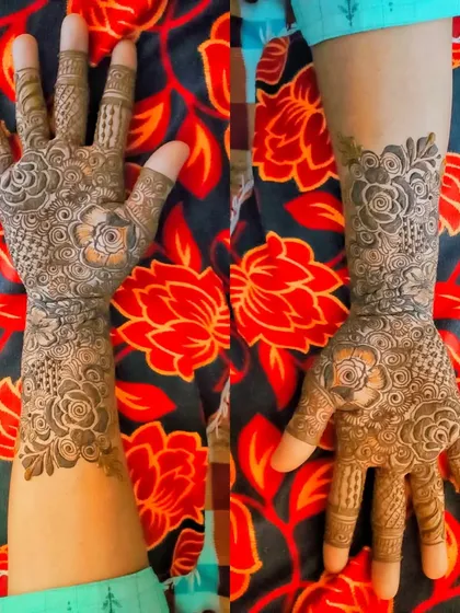 A full-arm design with repeating floral motifs, creating a look that is both intricate and harmonious.