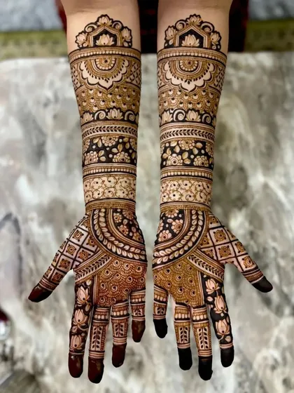 A detailed bridal design with a mix of floral, paisley, and geometric elements. The full coverage is perfect for a grand celebration.