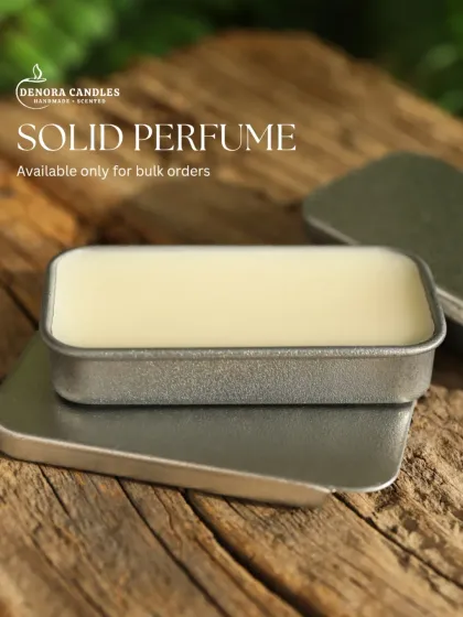 My solid perfume displayed on a piece of natural wood, emphasizing the product's connection to natural ingredients.