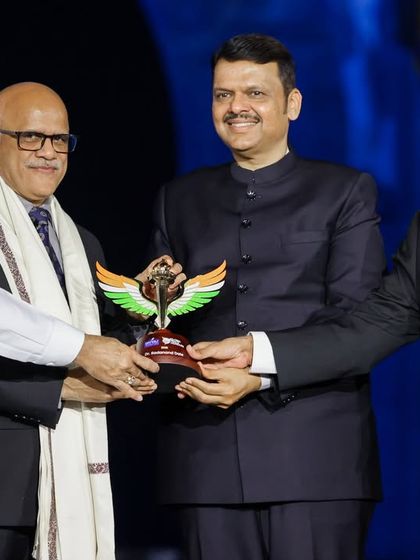 Dignitaries including Eknath Shinde, Devendra Fadnavis, and Mukesh Ambani presenting an award. We ensured seamless VVIP management and stage protocol throughout the Global Peace Honours ceremony.