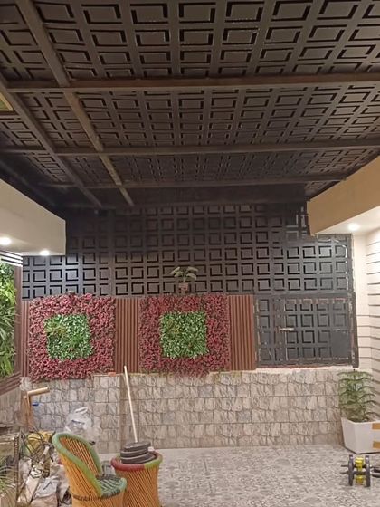 The finished look of the Najafgarh project with its unique laser-cut screens and vertical garden panels.